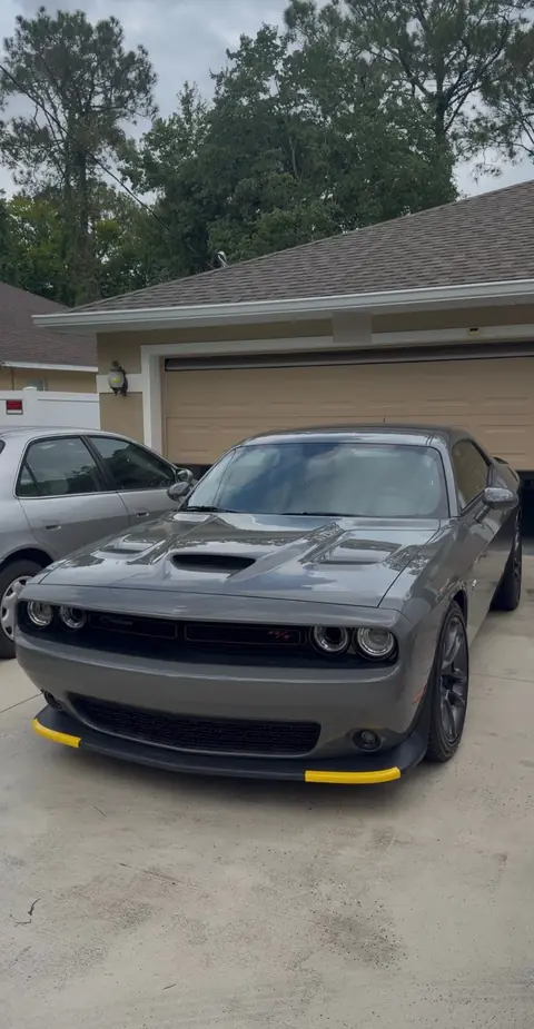 Gray Dodge Challenger R/T in a driveway after a detail