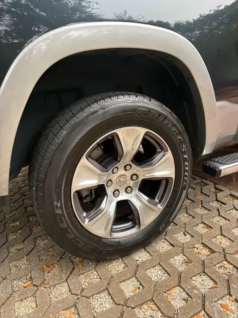 Cleaned wheel and dressed tire on a RAM pickup truck
